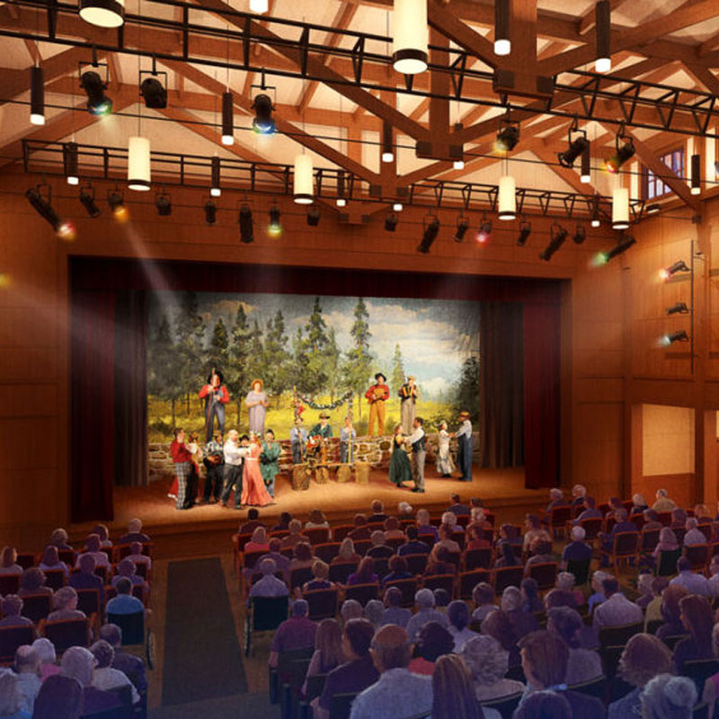 A photo rendering of inside the theater, from the view of the back of the theater, over the crowd, to the stage where a musical is being performed